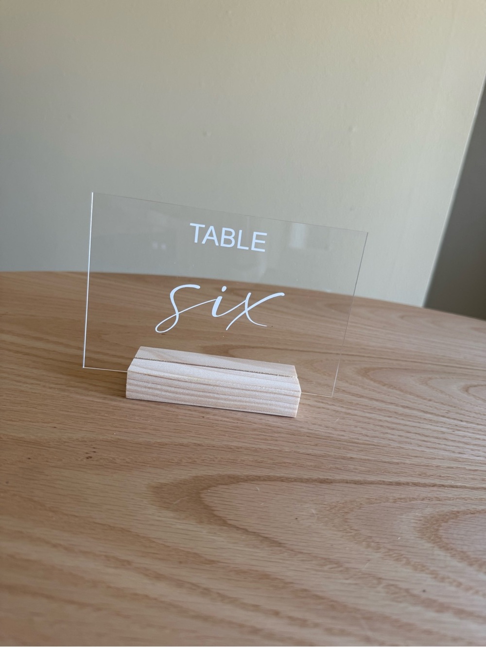 Clear Acrylic Table Signs with White Text and Natural Wood Base